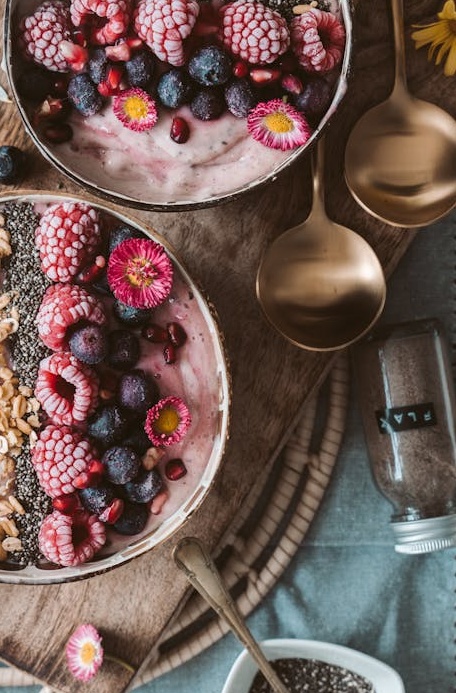 A person browsing their Instagram feed on a smartphone, seeing posts with many likes.