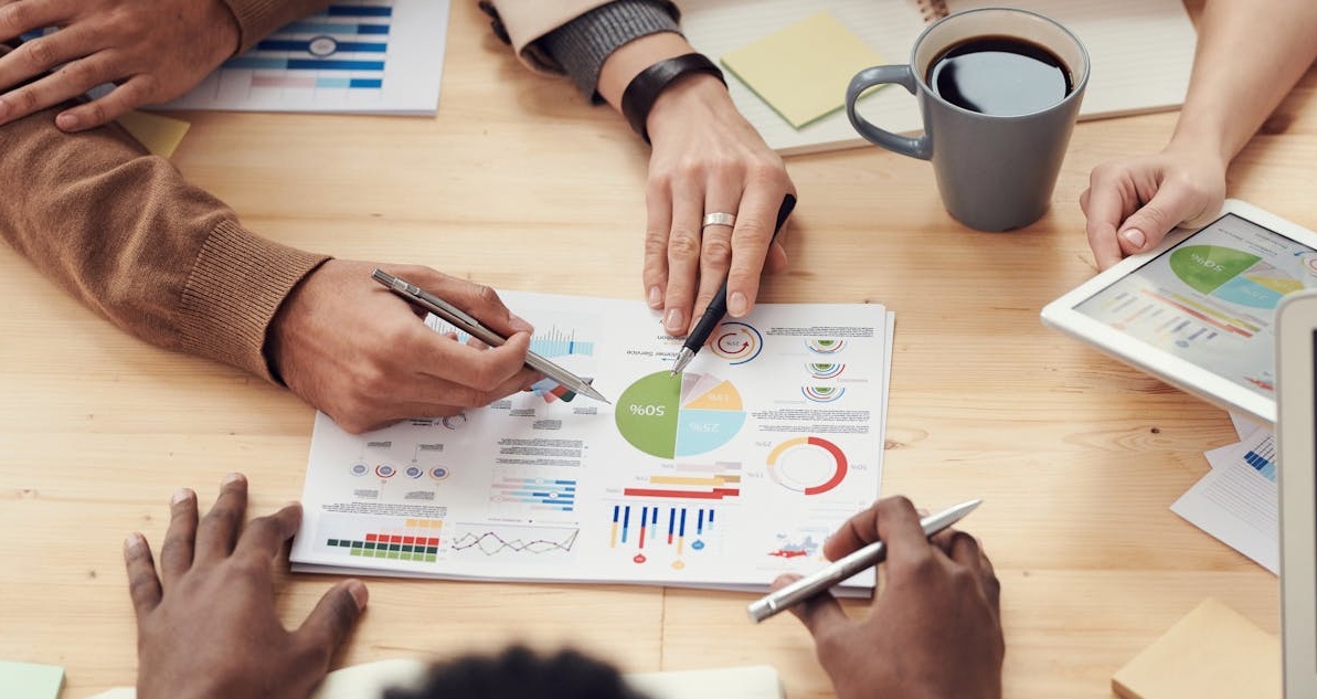 A marketing team strategically planning a Twitter campaign, including the use of stable video comments.