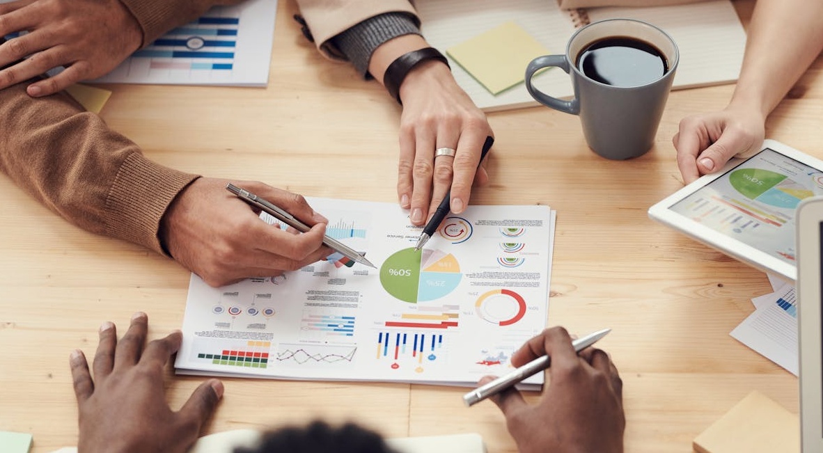 A team strategically planning a project, illustrating the need for a smart approach to buying YouTube subscribers