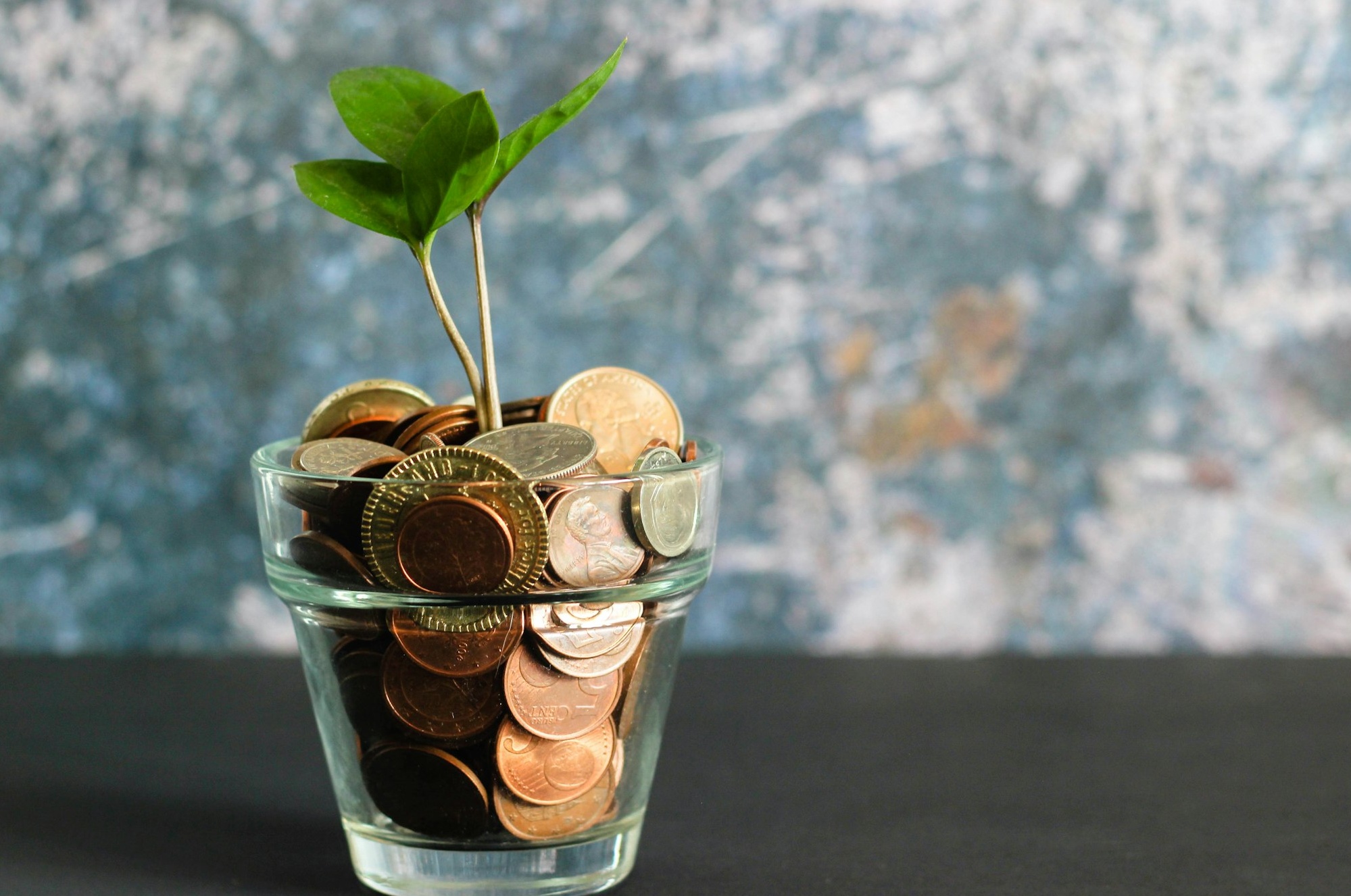 People collaboratively working on content creation, signifying the importance of partnerships and team efforts in YouTube marketing.