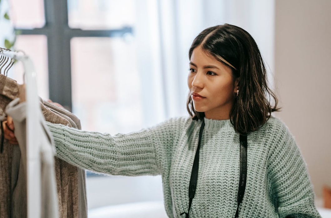 Person holding a stack of money, symbolizing financial success and monetization on platforms like YouTube