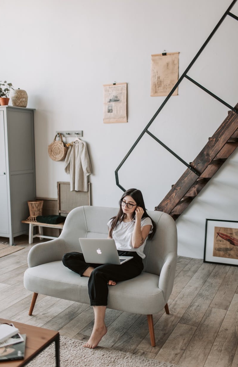 Person engrossed in watching a YouTube video on a smartphone, representing audience engagement